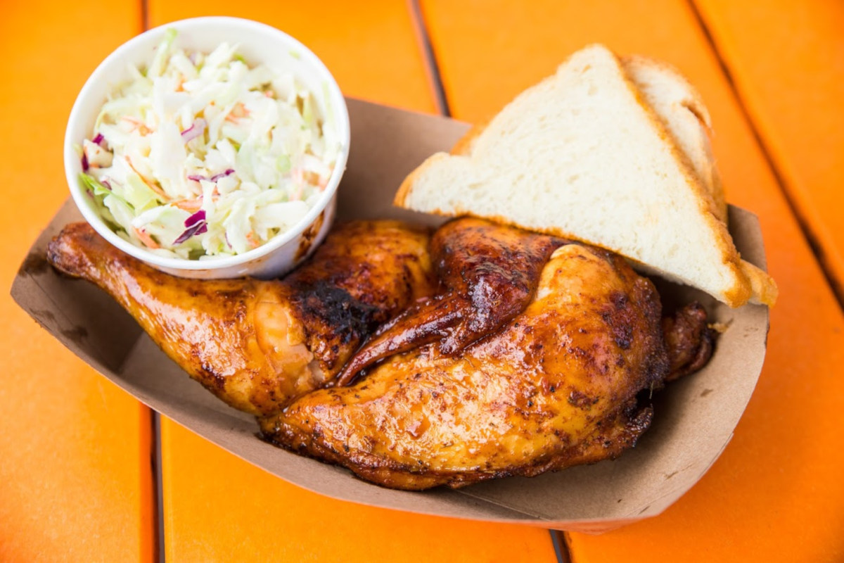 Grilled chicken, bread, salad on the sideRestaurant interior